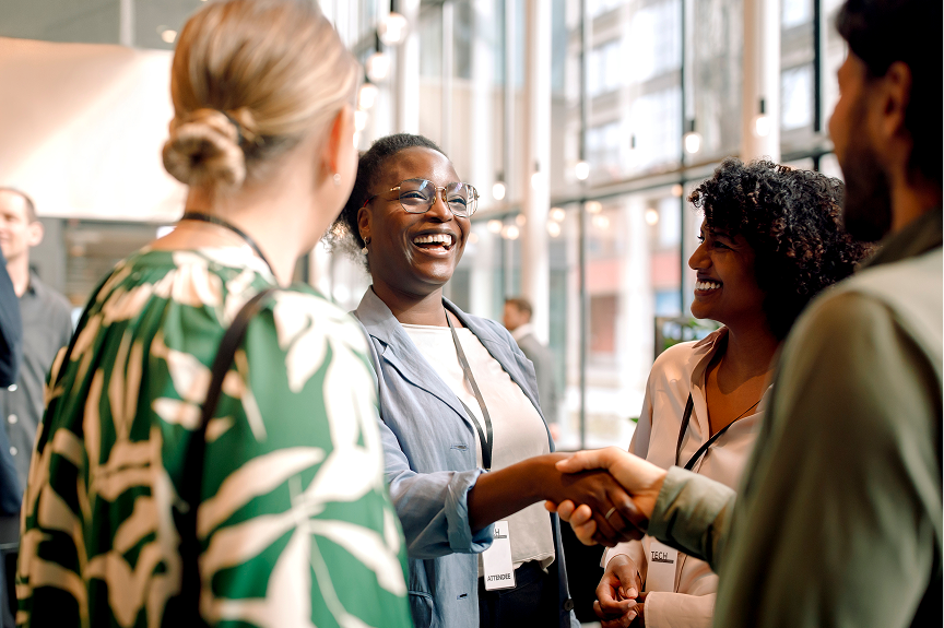 Smiling team greeting clients